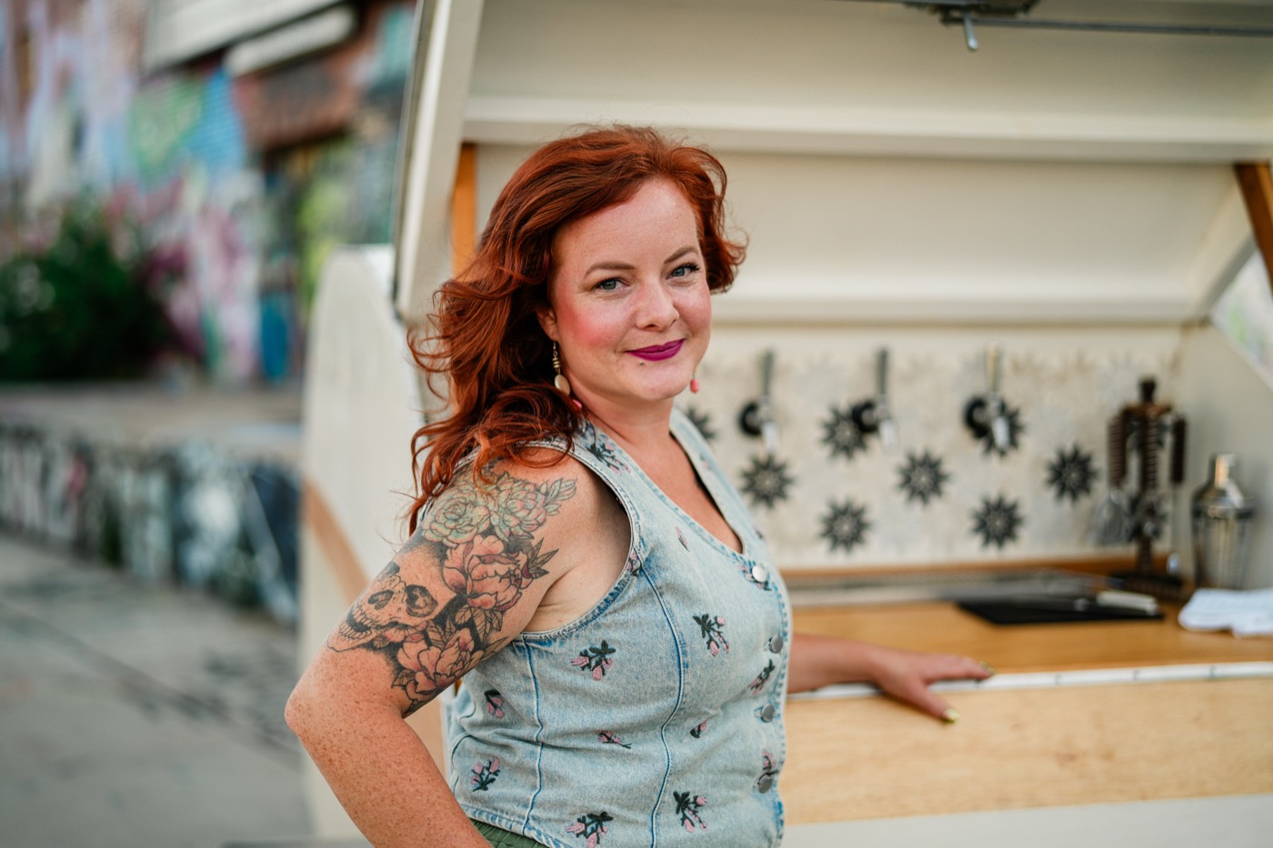 Aubre smiling in front of the Bar 59 trailer